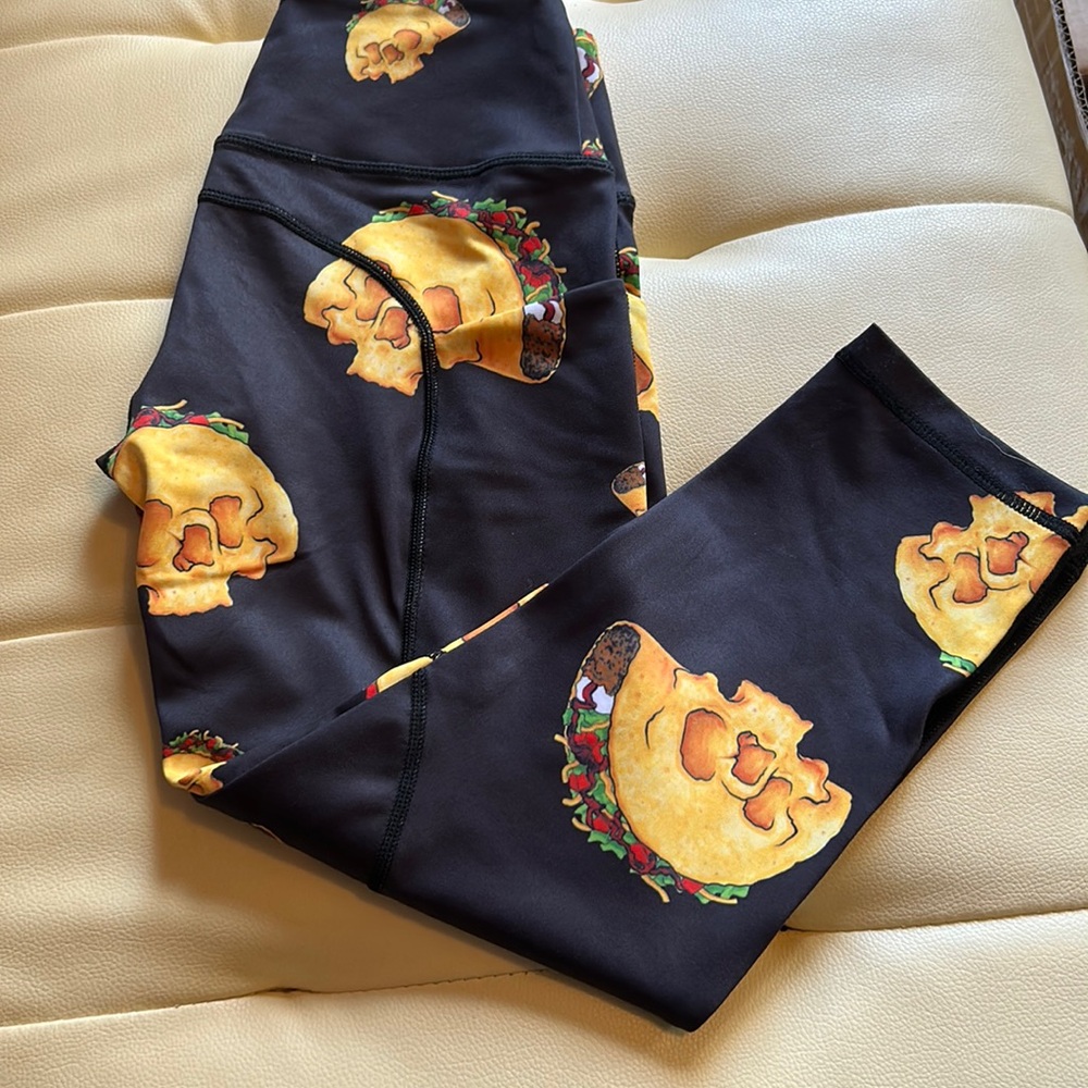Feed Me Fight Me Black Leggings with Yellow Taco Skull Print